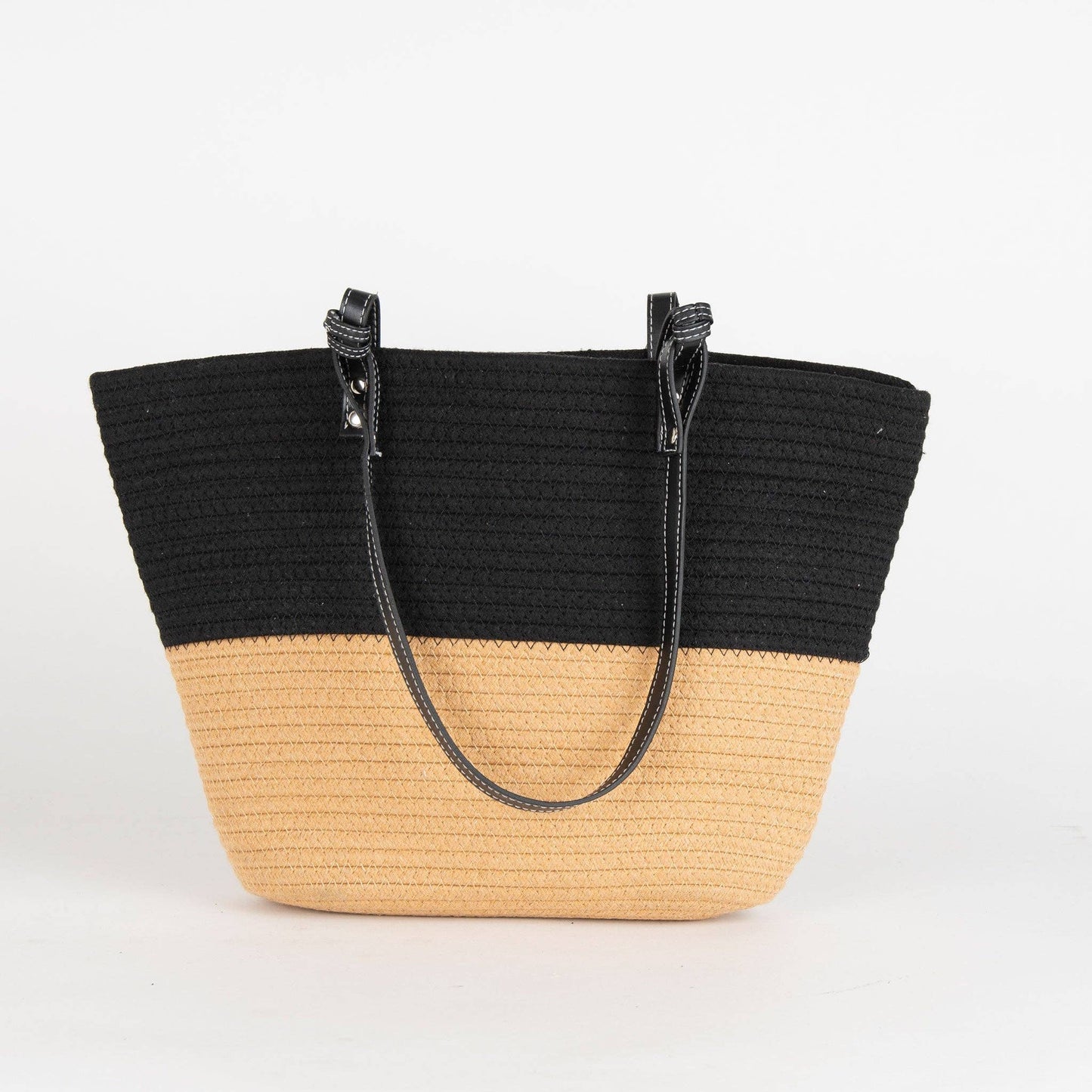 Black and beige straw tote bag on a white background