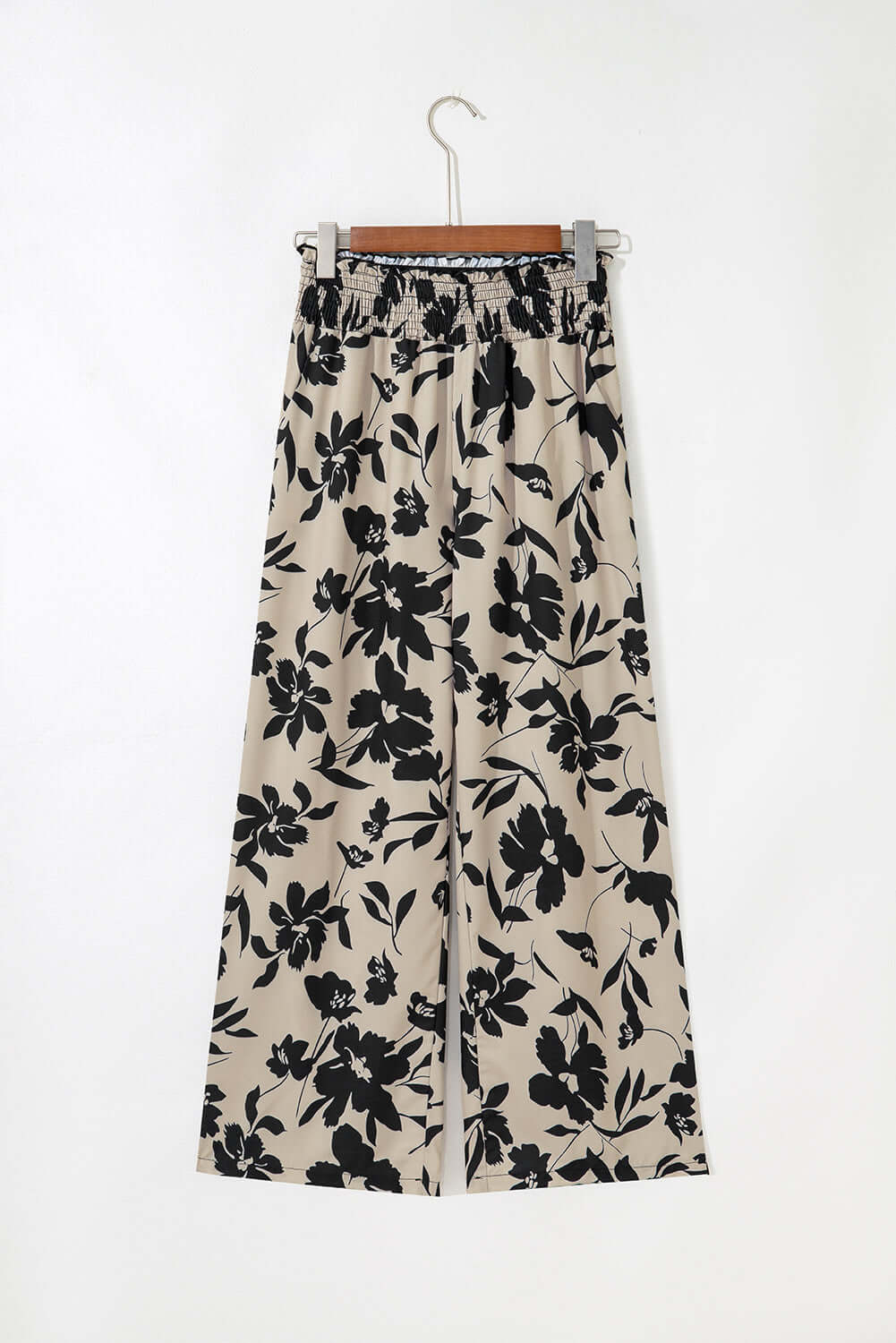 black floral pants with a white background