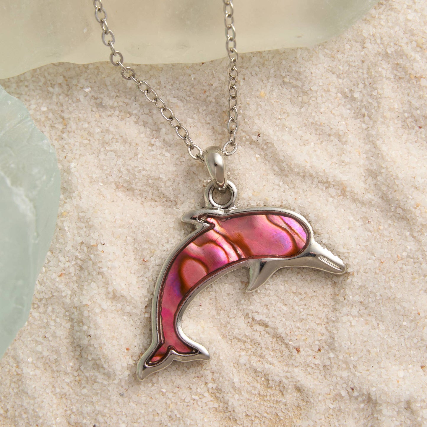 Abalone shell dolphin pendant necklace from Howard's beach jewelry, featuring a colorful dolphin design on a chain.