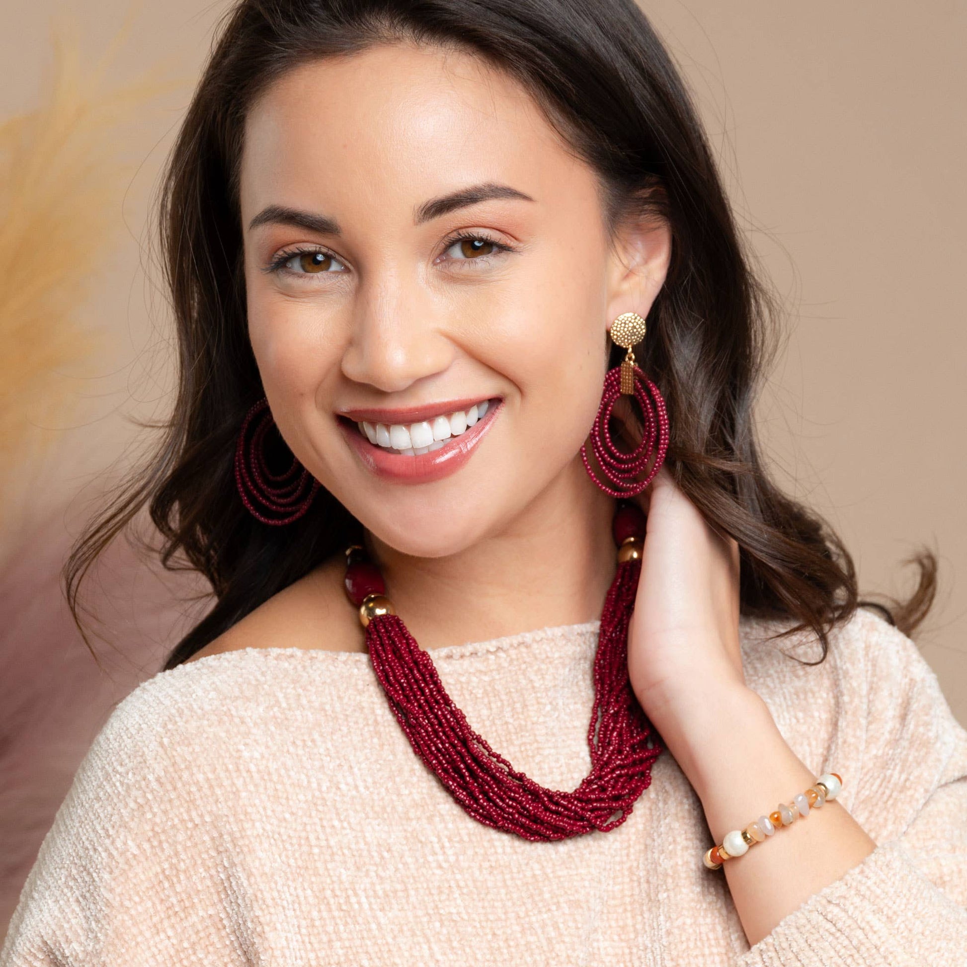 Howard's hoop seed bead nickel-free drop earrings with colorful seed bead details and silver-toned hoop design.