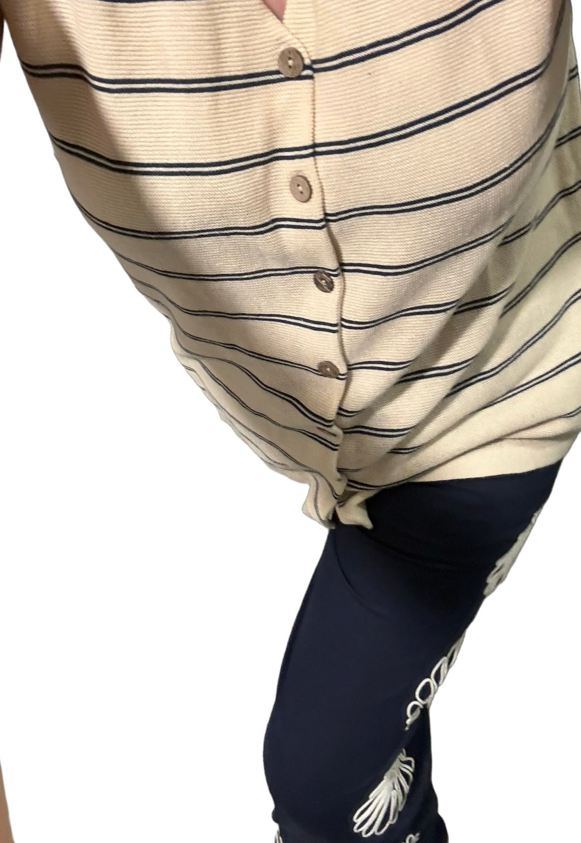 Beige striped shirt with buttons on a white background