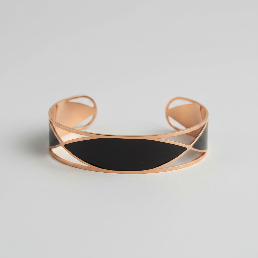 Rose gold bracelet with black accent on a wooden surface