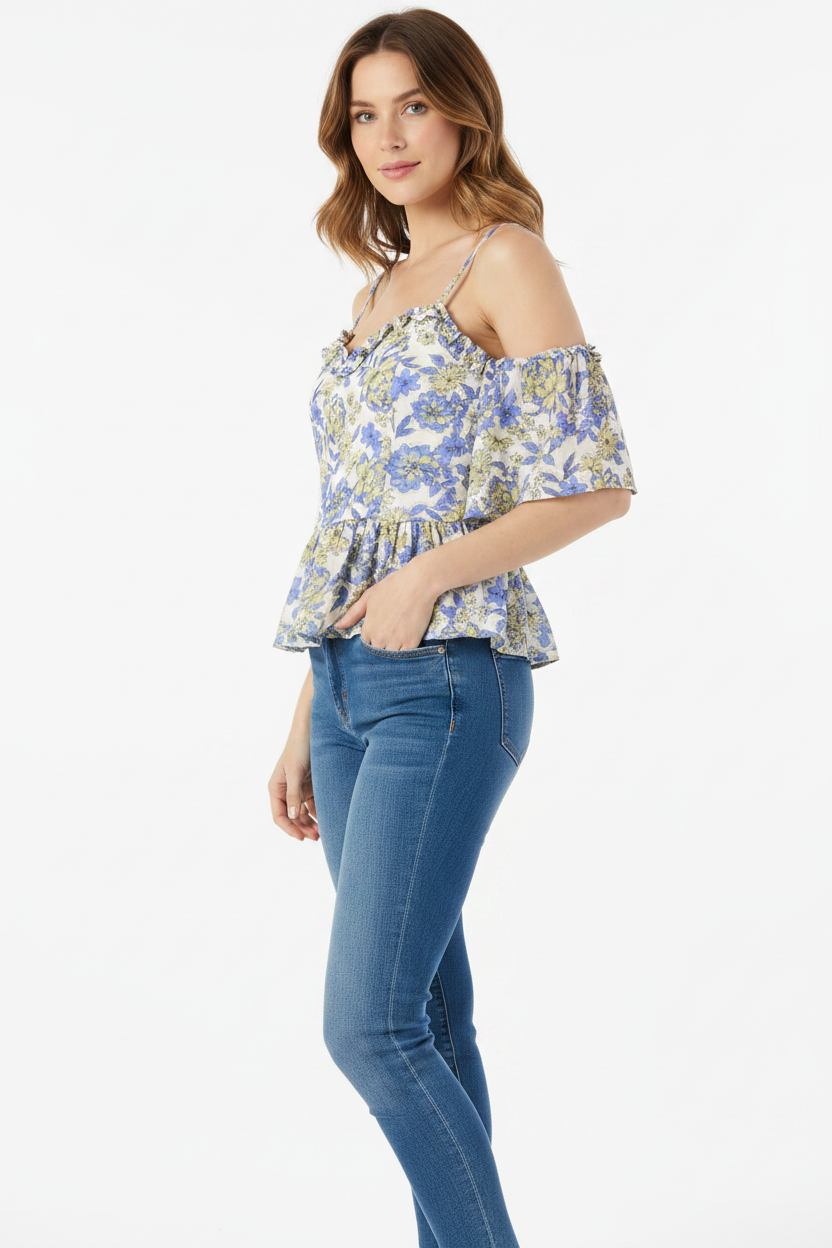 Floral top with ruffled sleeves on a white background