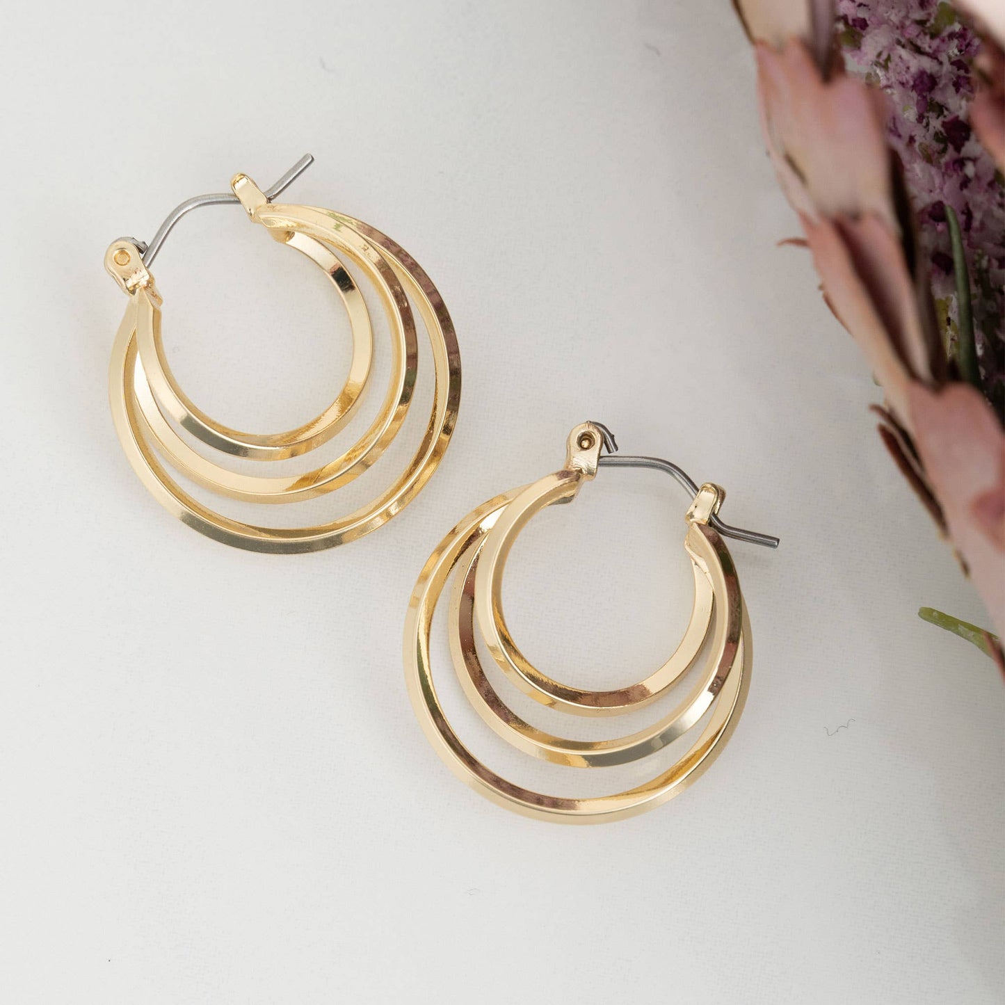 Gold Hoop Earrings featuring a classic multi-hoop design, perfect for elevating any outfit with their stylish charm.