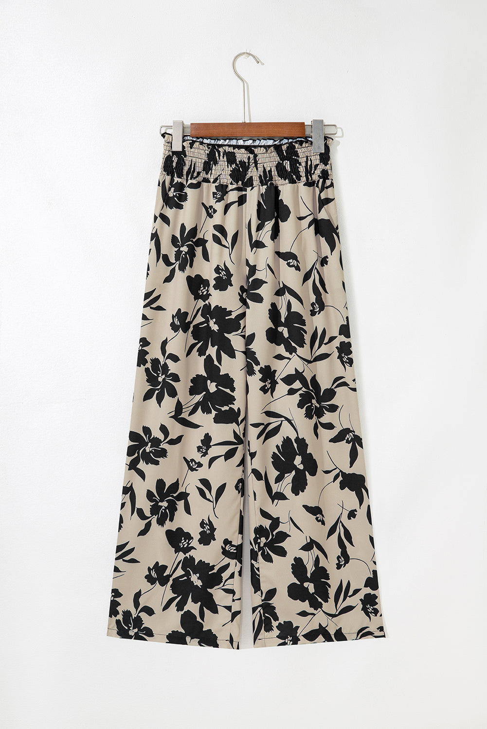 black floral pants with a white background