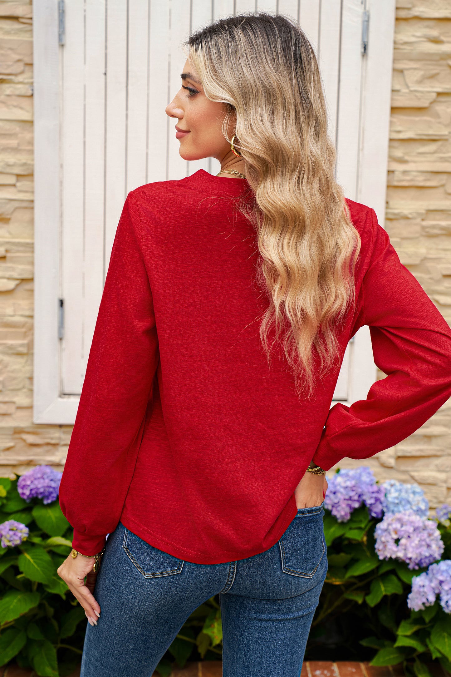 red long-sleeve top with buttons 