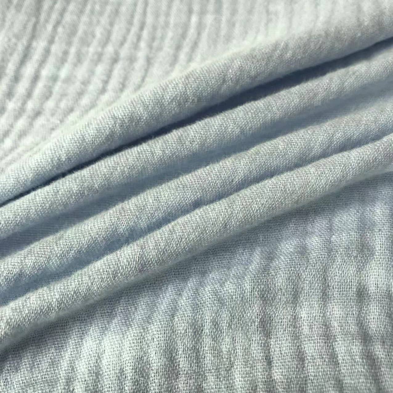 Close-up of light blue fabric with visible texture