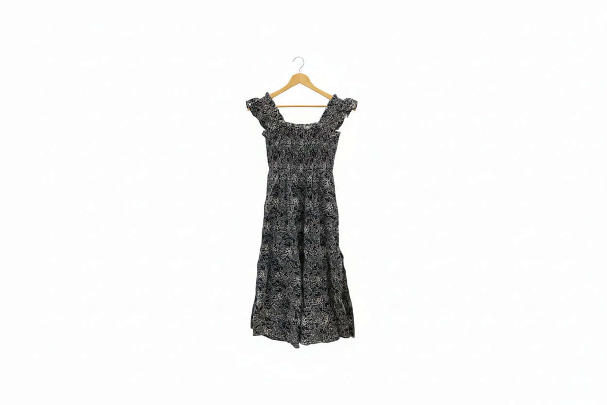 Navy embroidered smocked midi dress with puff sleeves and floral details, perfect for summer, by Chic Speak Boutique.