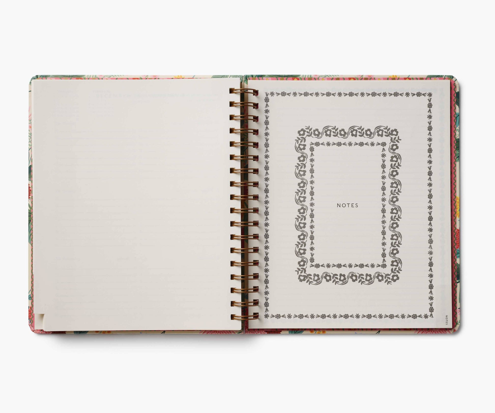 Open notebook with decorative cover and page design on a white background